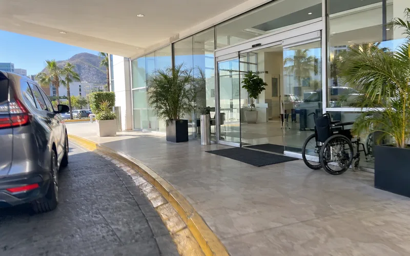 Modern glass entrance of a private hospital in a Mexican city